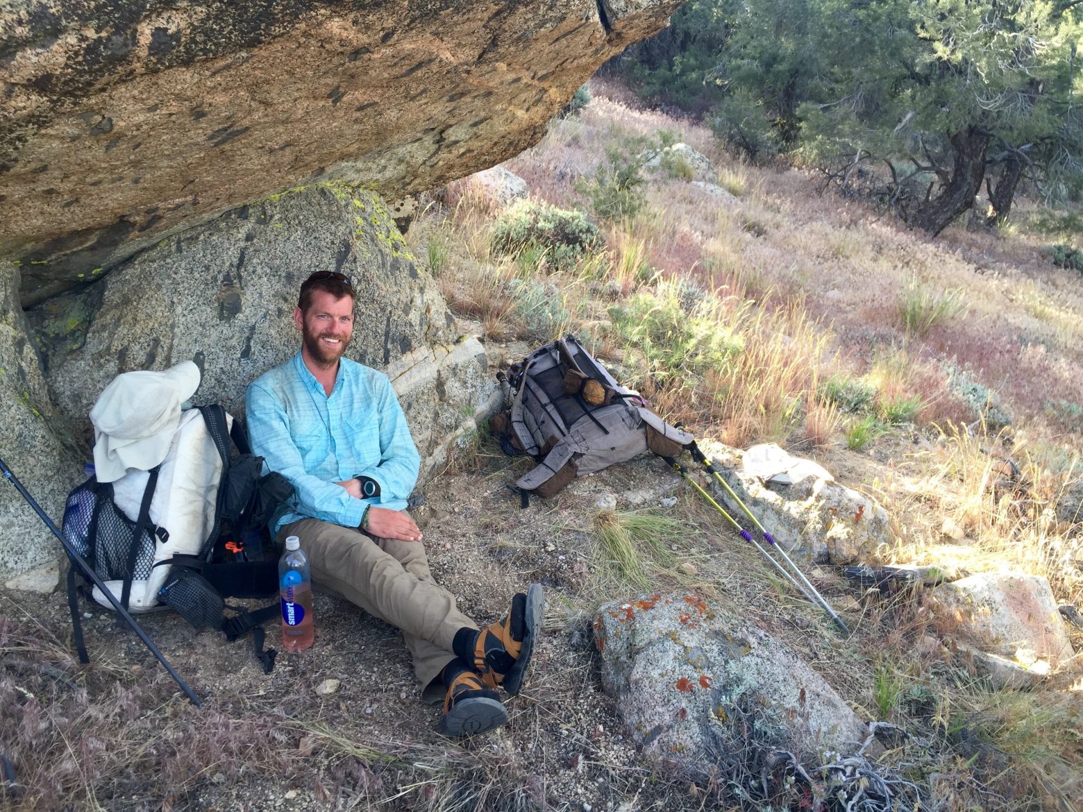 Mountain Man at a perfect break spot beneath a rock overhang