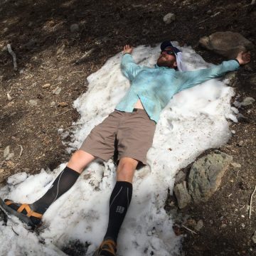Mountain Man making a snow angel