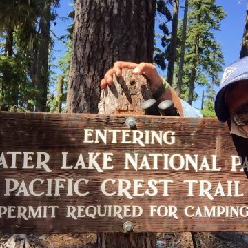 Mountain Man at Crater Lake National Park boundary sign