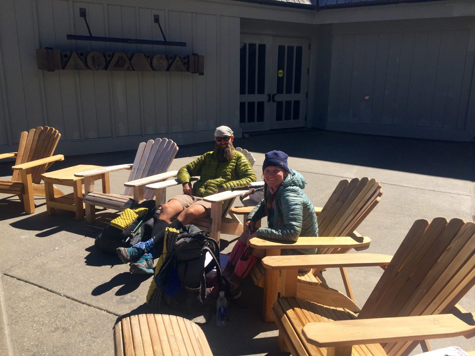 Beardoh and Sweet Pea lounging on the patio of Timberline Lodge