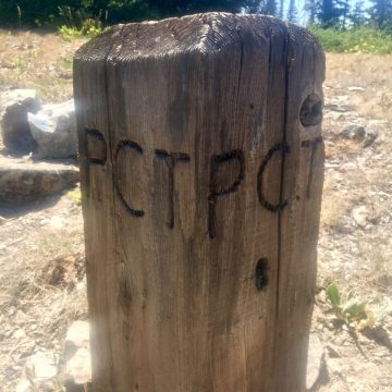 Small wooden post with PCT carved into it