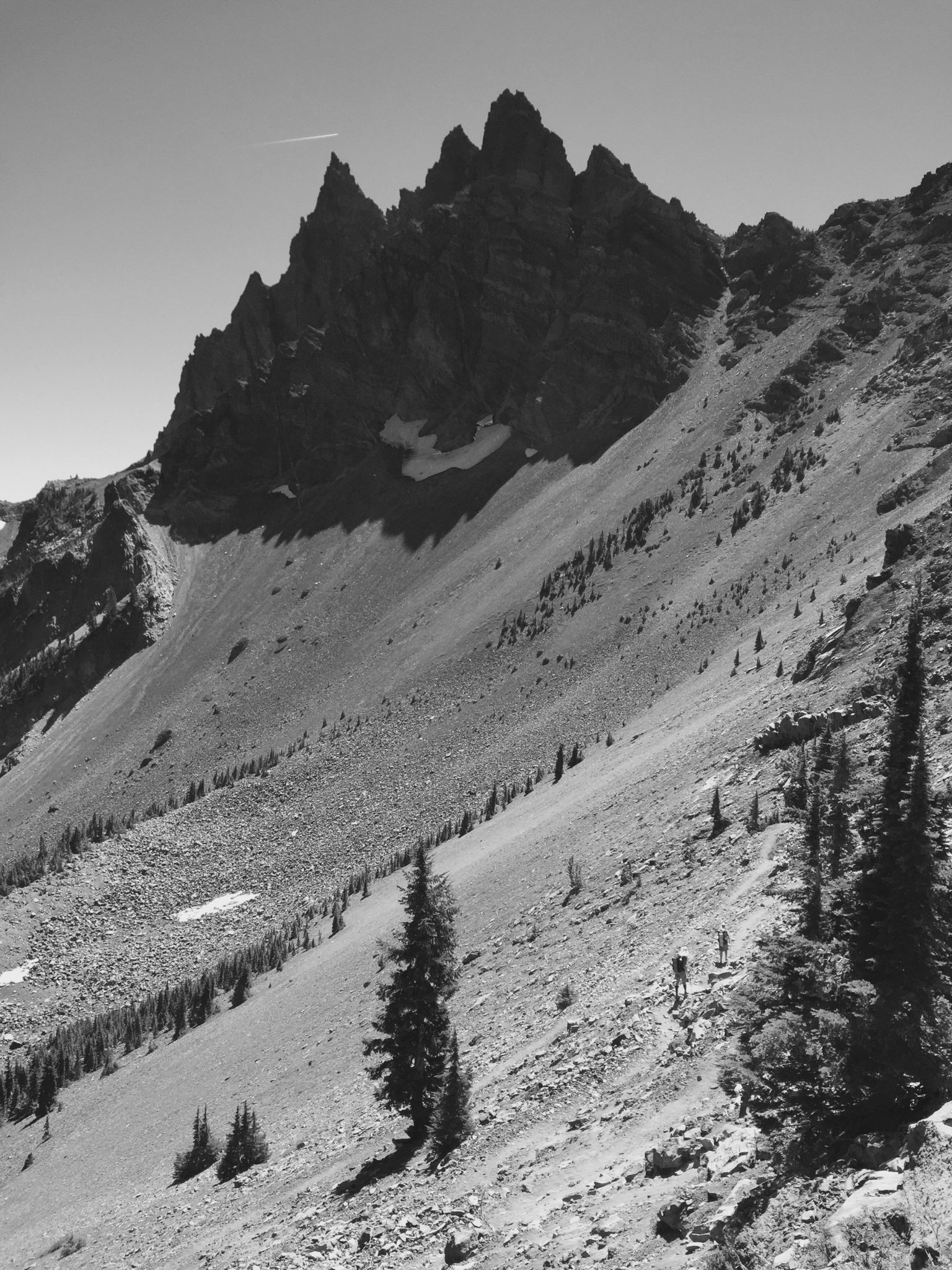 Talus slopes sweeping up to steep north face of Three Fingered Jack
