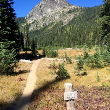 Trail sign under blue skies near Deep Lake and Cathedral Rock