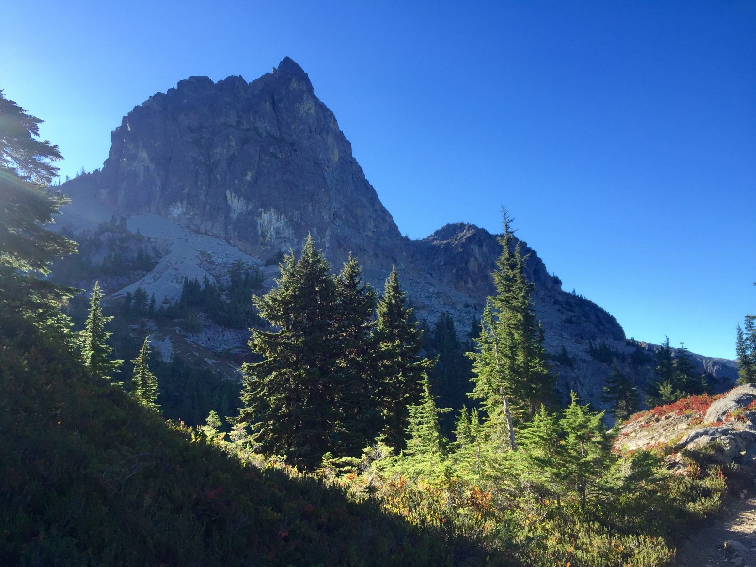 The shark-fin shaped outline of Cathedral Rock against a blue sky