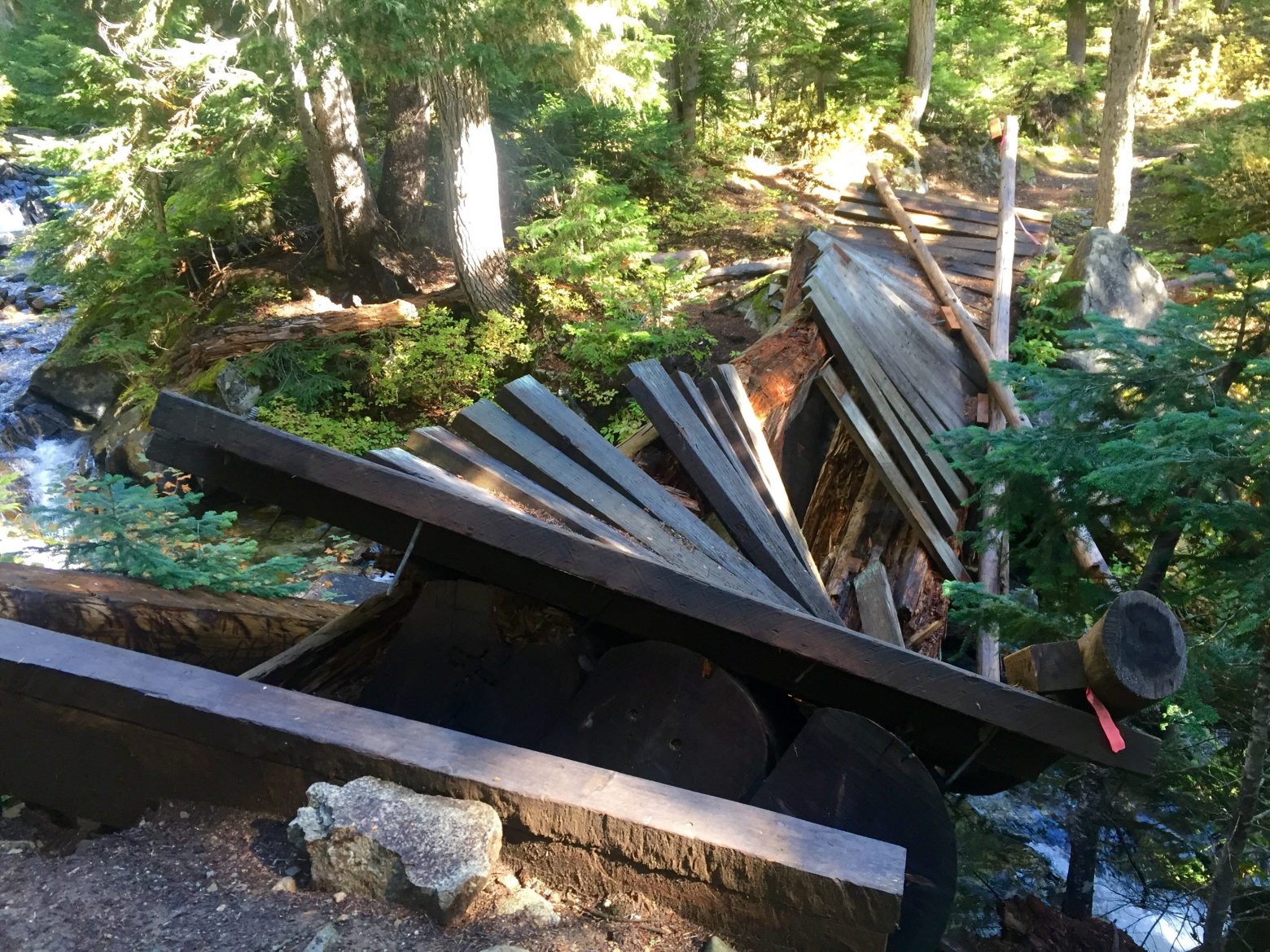 Trail bridge over a creek completely destroyed and unusable