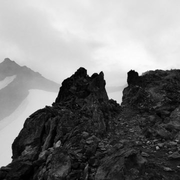 Black and white looking along the Knifes Edge in the clouds
