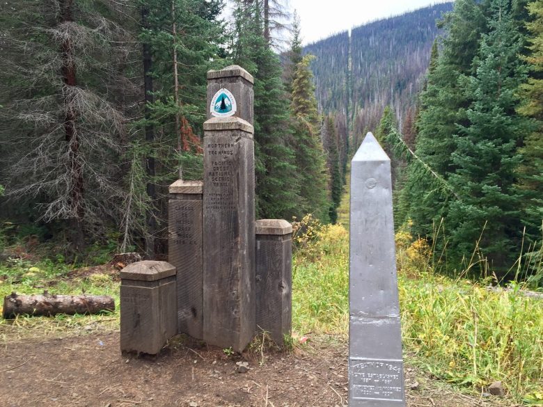 Wooden border posts at PCT northern terminus and US-Canada border obelisk