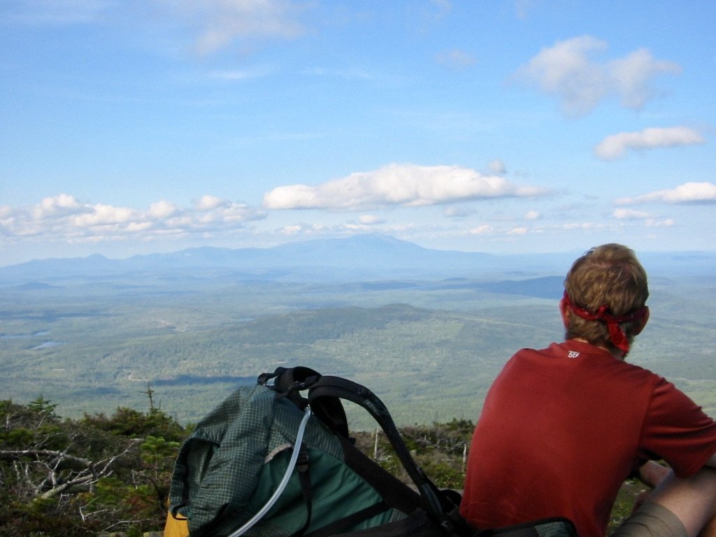 Mountain Man and the first view of Katahdin from White Cap Mountain Man and the first view of Katahdin from White Cap