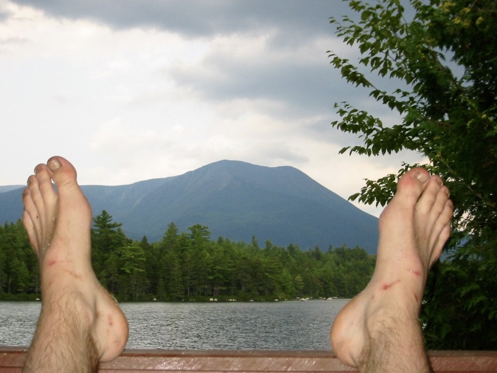 Mountain Man feet framing Mt. Katahdin From Daicey Pond