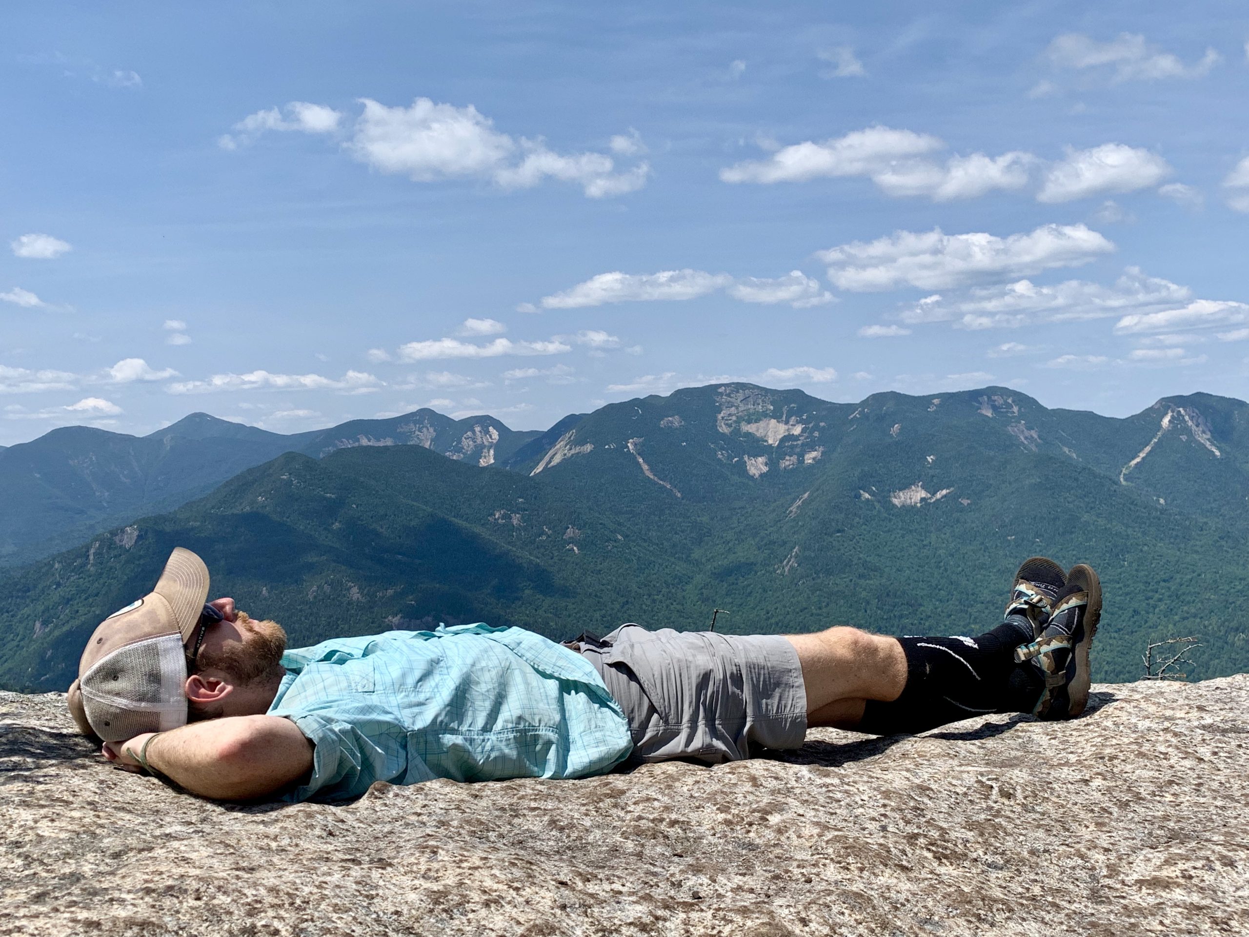 Lying on the summit of Dial Mt. with a Great Range backdrop