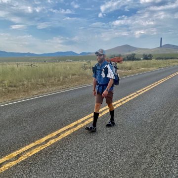 Mountain Man walking in the center of the highway