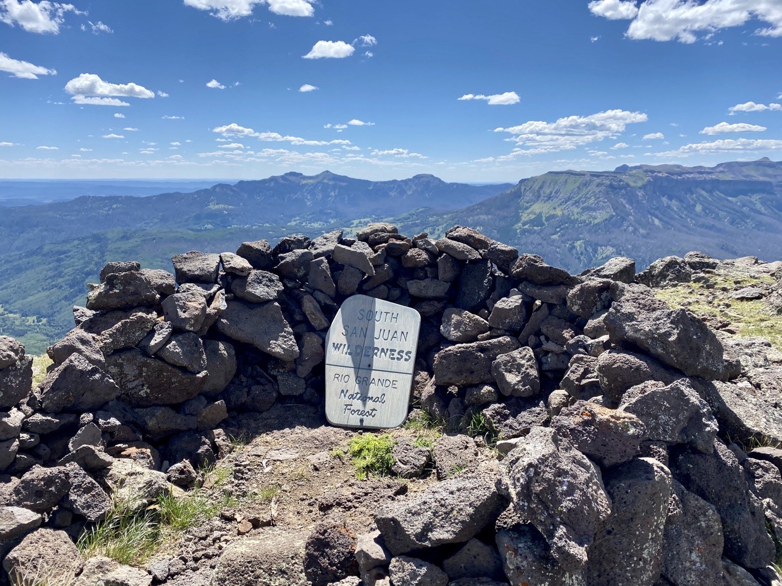 Even the wilderness sign needs to take shelter from the wind