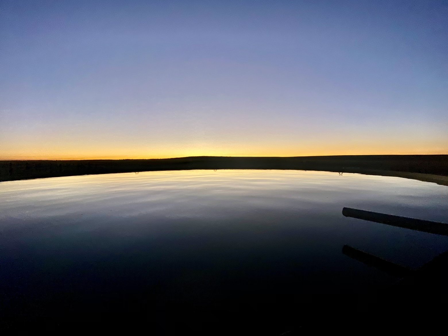 Sunset reflection in a water tank