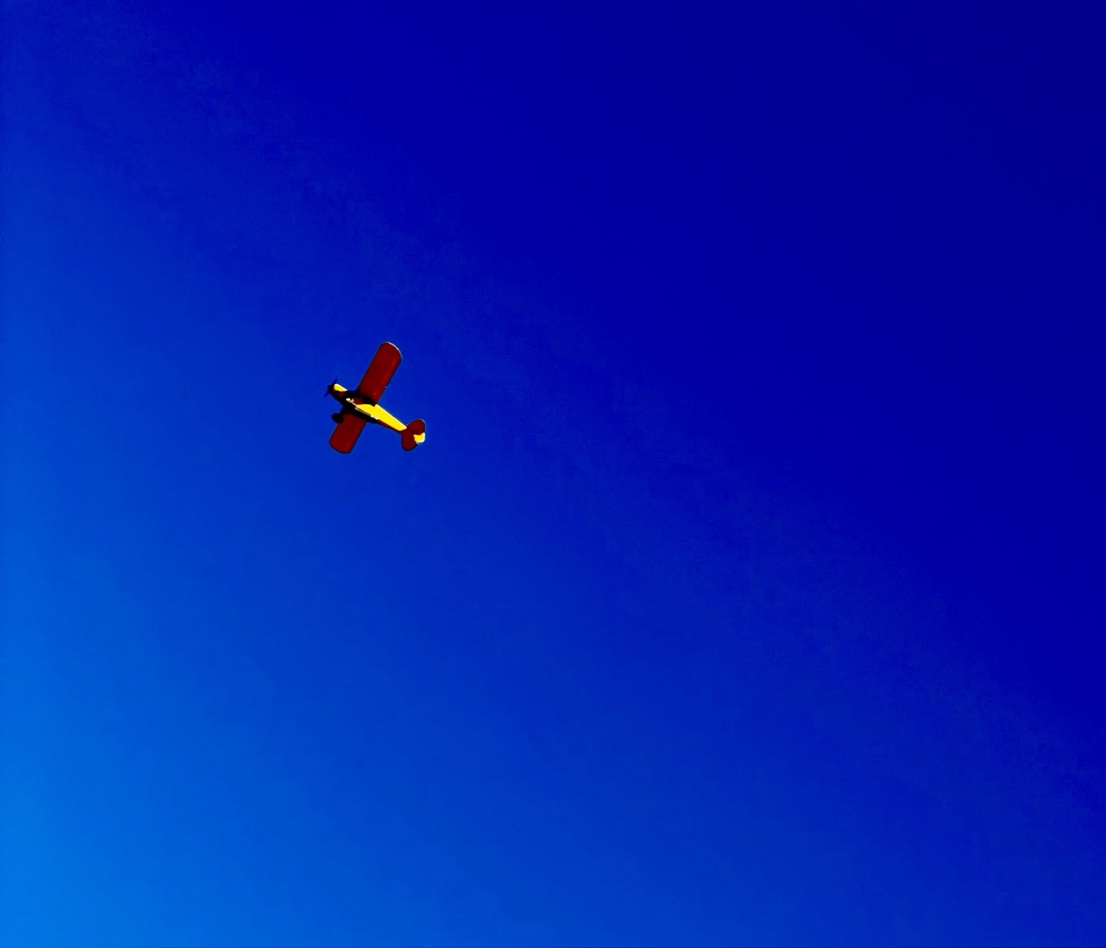 Low flying plane and blue sky